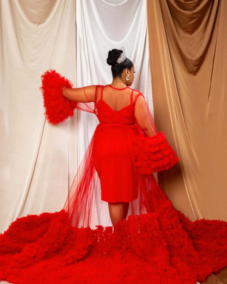 Bride wearing a red robe with hair vine. dressing robe for wedding day shoot